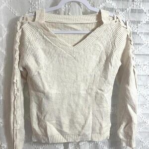 Super soft Cream knit sweater with cut-out lace details down the arms size small